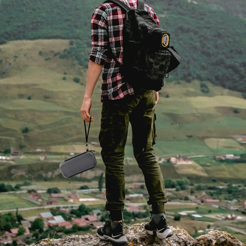 Person hiking with Hard Travel Power Bank Case For Anker USB C Portable Chargers 737 735 736 717 With Half Mesh Cable Pocket