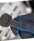Close-up of Heavy Duty Pneumatic Air Hammer Chisel Set tool in use, held by gloved hand, used in metal shaping and construction projects