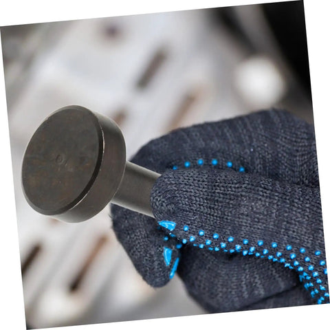 Close-up of Heavy Duty Pneumatic Air Hammer Chisel Set tool in use, held by gloved hand, used in metal shaping and construction projects