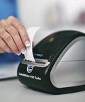 LabelWriter 450 Turbo Direct Thermal Printer in use, printing inkless label, compact design, ideal for office tasks.