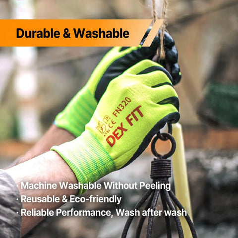 Hands wearing green work gloves labeled Dex Fit using tools outdoors