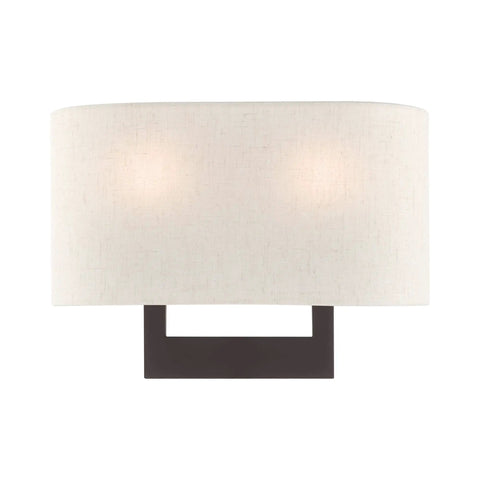 Bronze Wall Sconce With Contemporary Design, showcasing two-light feature with oatmeal shade, modern lighting for living rooms.