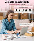 Woman using laptop with Pink Bluetooth Thermal Label Printer 4x6 For Small Business, Inkless Fast Printing For Amazon Shopify USPS FedEx nearby.
