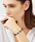 Woman wearing bracelet with Golden Crown Beads Set 11x7mm Large Hole Crystal Cubic Zirconia Pave King Crown Charms on wrist