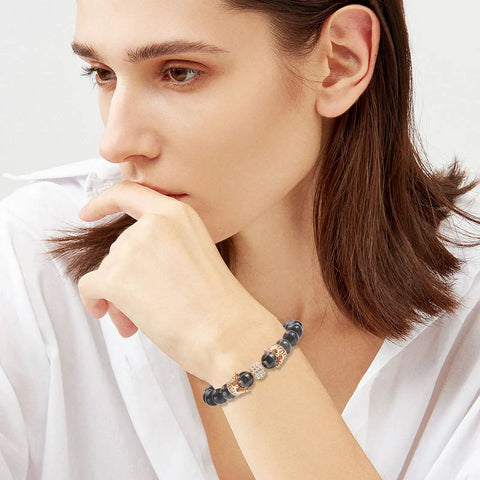 Woman wearing bracelet with Golden Crown Beads Set 11x7mm Large Hole Crystal Cubic Zirconia Pave King Crown Charms on wrist