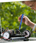 Child using Rc Car Screws And Fasteners Kit Pro Grade Repair Tool Set With Wrench Nuts Bolts And Case For Multiple Models Gear Up For Quick Fix.