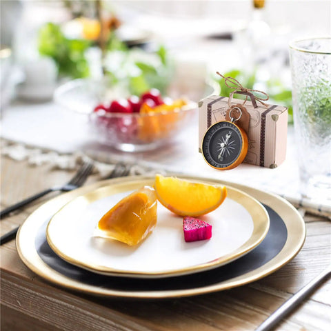 50 Piece Compass Themed Candy Boxes Gift Set in Gold and Rose Gold for sweet treats on a decorated wedding table.