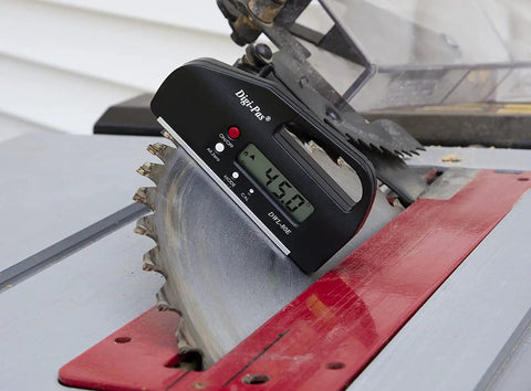 Pocket Size Digital Level And Angle Gauge Protractor on saw blade for quick bevel, 0.1 degree precision, 4 inch compact handy tool.