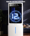 Portable Evaporative Swamp Cooler Game Changer With 10L Tank 12 Hour Timer Auto Oscillation illuminated display with user relaxing nearby.