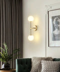 Modern Wall Sconce 2 Light Industrial Mid Century Vanity Light With White Globe Glass Shade Brushed Brass Gold Finish For Bathroom Or Hallway Sleek Home Decor That Pops mounted on living room wall