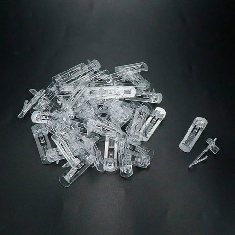 Heavy Duty Clear Shelf Support Pegs With Self Locking Grip For 5/16 Inch Holes And 19/32 Inch Thick Shelves Rock Solid 50 Pack transparent clips piled together