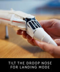 Hands adjusting the droop nose on the Iconic Concorde Model Aircraft Building Kit For Adults With Realistic Details And Functional Pieces Build A Dope Supersonic Passenger Jet Replica For Relaxing, Collectible Hobby Project.