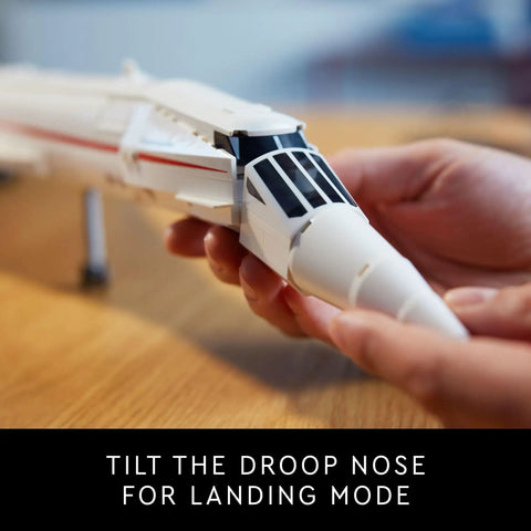 Hands adjusting the droop nose on the Iconic Concorde Model Aircraft Building Kit For Adults With Realistic Details And Functional Pieces Build A Dope Supersonic Passenger Jet Replica For Relaxing, Collectible Hobby Project.