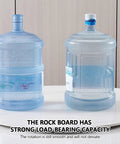 Polished Marble Lazy Susan Turntable with smooth rotation supporting large water bottles on a kitchen countertop.