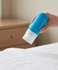 Blue bottle from Carry On Ready Travel Bottles Kit 16 Pack TSA Approved Leak Proof Silicone Squeezable Containers For Toiletries
