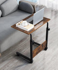 Rock Solid Height Adjustable Computer Desk With Smooth Rollin Casters For Easy Repositioning And Firm Lockdown Heavy Duty Steel Top crafted as a compact workstation beside a sofa.