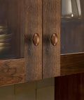 Kick Up Your Home Decor Game With Four Slick Bronze And Walnut Wood Cabinet Knobs Featuring Tight Vintage Style Brass Drawer Pulls For Kitchen And Dresser Cabinets on a cabinet.