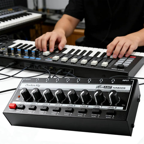 HA800S Eight Channel Stereo Line Mixer for Sub Mixing with controls shown in a studio setup with keyboard