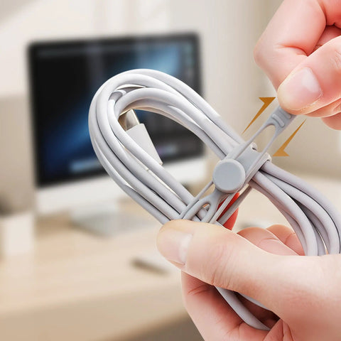 Hands using Silicone Cable Ties 10 Pack Reusable Wire Wraps For Office And Home Use, Multipurpose Cable Management on charging cord.