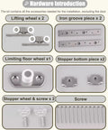 Hardware components for Upgrade Your Space With This Heavy Duty Black Barn Door Hardware Kit including wheels, screws, and iron pieces.