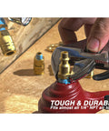 Close-up of a hand tightening Brass 1/4 Inch NPT Male Air Couplers Set, Six Piece Industrial M Style Quick Connect Fittings on red tool