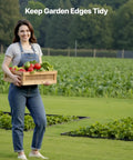 Person holding vegetables with garden beds bordered by No Dig Garden Edging Border Kit With 60 Spikes, 10 Pieces of 6 Feet Each.