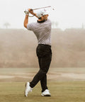 Golfer using Right Hand Golf Swing Training Aid That Improves Clubface Awareness, Swing Plane, And Impact For Consistent Distance.