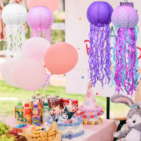 Jellyfish Paper Lanterns 6 Pack Hanging Lit Colorful Lanterns For Mermaid Unicorn Theme Classroom Decor Under The Sea Ocean Birthday Party Decorations For Undersea Parties Classroom Decor And Birthday Celebrations displayed above a birthday table setting with cake and balloons.