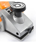 Close-up of Heavy Duty Electric Wood Planer Pumping Out 980 Watts At 23000 Rpm showing depth adjustment knob and tough aluminum base.