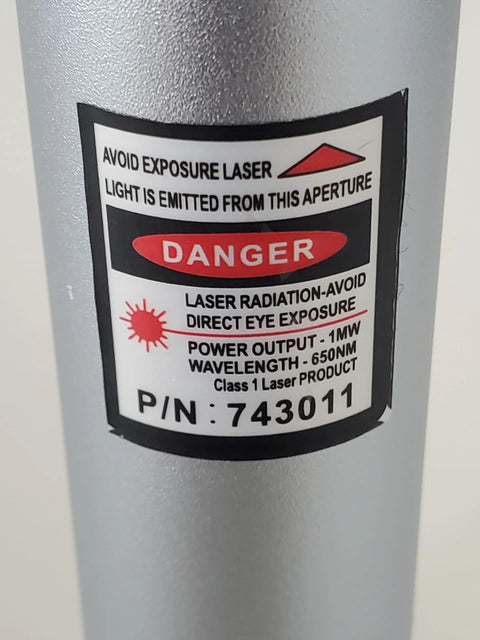 Visual fault locator laser tool in gray metal housing with laser warning label and P/N 743011.