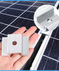 Hand holding an aluminum mid clamp for solar panel with detailed close-up, part of a 12 pack Aluminum Solar Panel Mid Clamps 1.06 Inch For Secure Mounting