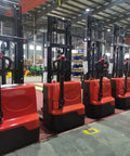 Battery Powered Electric Pallet Stacker Truck With Walk Behind Hydraulic Lift in a warehouse setting with heavy-duty design