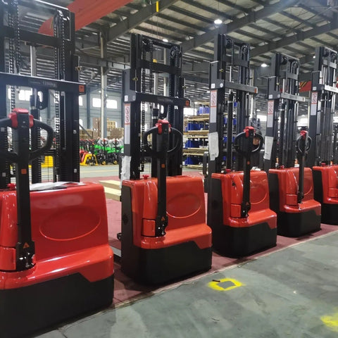 Battery Powered Electric Pallet Stacker Truck With Walk Behind Hydraulic Lift in a warehouse setting with heavy-duty design