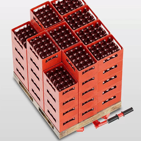 Heavy Duty Machinery Skates With Steering Handle dual PU or steel wheels moving stacked red crates on a wooden pallet.