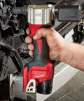 Hand holding the Killer Grade Cordless Rivet Tool Fits Milwaukee M12 12V Systems for fastening aluminum and steel.