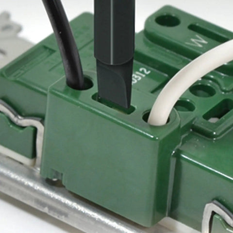 Close-up of Ball Grip Interchangeable Screwdriver Kit With One Quarter Inch Hex Bits Pro Grade in use on electrical terminal