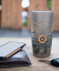 Front view of a tall stainless steel insulated tumbler with a woodworking workshop graphic.