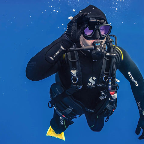 Diver wearing Hydros X Front-Adjustable Men's Scuba BCD With Balanced Power Inflator exploring underwater