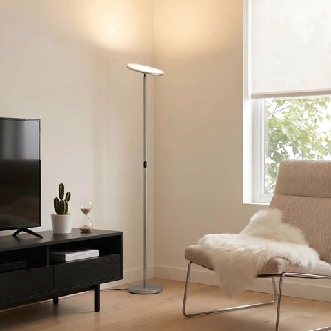 Super Bright LED Floor Lamp Torchiere For Living Room And Office Dimmable Tall Standing Lamp With Warm 3000K Glow 2190 Lumens Brushed Nickel Finish next to armchair