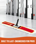 Make Spotless Floors A Snap With This 36 Inch Commercial Dust Mop Boasting A Thick Microfiber Head For Zero Hassle Tile And Hardwood Sweeping And Wet Mopping In Red on a smooth floor.