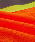 Close-up of Heavy Duty Neon Orange Mesh Safety Vest With Seven Pockets And 3M Reflective Tape showing breathable mesh fabric.
