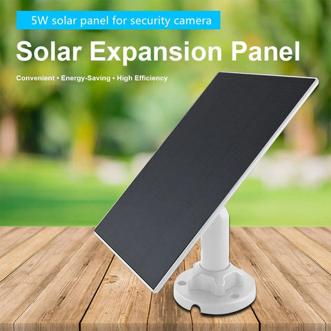 5W Outdoor Solar Panel For Wireless Security Cameras With USB C And Micro USB Compatibility, mounted on wooden surface