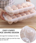 Person holding Two Pack Covered Egg Holders For Fridge Clear Plastic Deviled Egg Tray Carrier With Lids Holds 36 Eggs