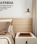 Premium Walnut Wood Jewelry Tray With 15 Grid Compartments, displayed on a bedside table beside bed pillows.