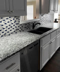 Kitchen backsplash with Blue Crystal Glass and Gray Stone Mosaic 1x2 Subway Tile Sheet, 12x12 Inches, polished marble look.