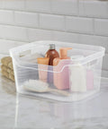 Solid As A Rock Clear Storage Bins Three Pack Tough As Nails Transparent Plastic Crates on countertop with toiletries