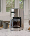 12 Cup Programmable Drip Coffee Maker With Glass Carafe, Pause And Pour, Auto Shut Off on marble countertop in kitchen