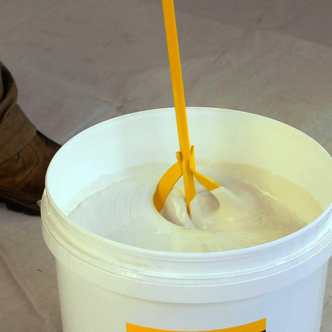 Beefy Paint And Mud Mixer Stirrer For Drill, 1 To 5 Gallon Drums, Fits All Standard Drill Bits, Hex Head Non Slip, Easy To Clean Paint And Plaster Mixing Paddle Tool Yellow mixing white paint in a 5-gallon bucket