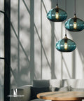 Pendant Lights Kitchen Island Hand Blown Glass UFO Ceiling Light Fixture With Seeded Bubbles over a modern living room