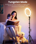 Warm tungsten lighting from 12 Inch Ring Light With 72 Inch Tripod enhancing mother-child reading session, teddy bear beside.